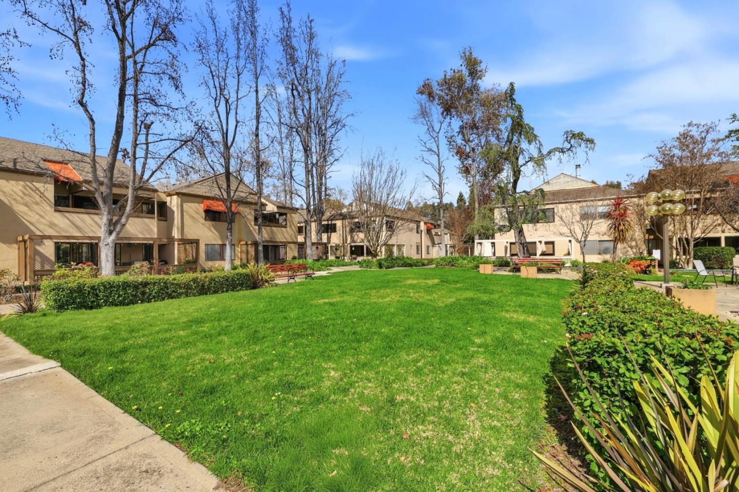 449 Alberto Way, Unit 132 Los Gatos, CA 95032 - Photo 32 of 42 a view of a yard with a house in the background