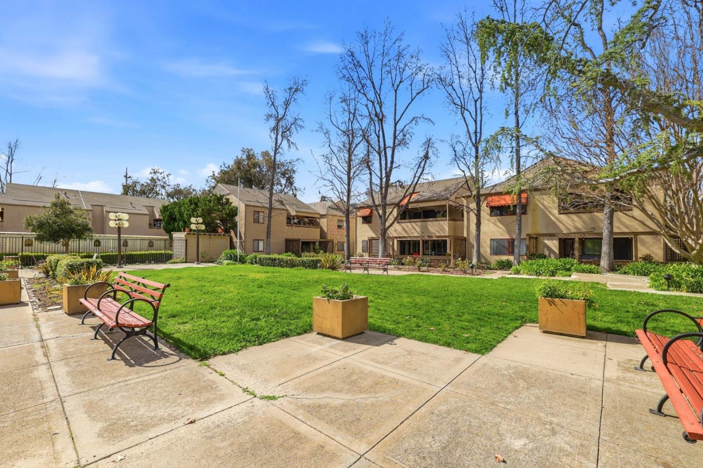 449 Alberto Way, Unit 132 Los Gatos, CA 95032 - Photo 37 of 42 a view of a building with garden and tall trees