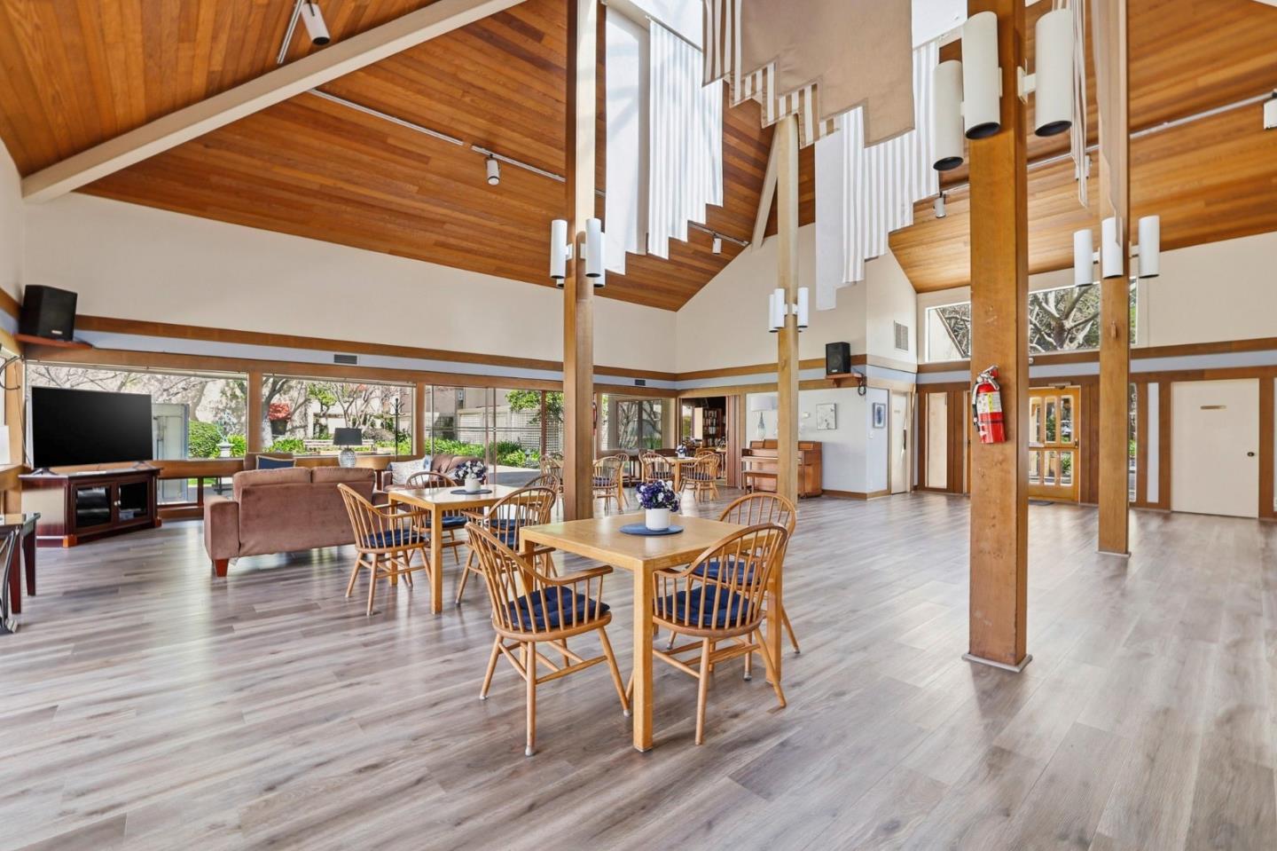 449 Alberto Way, Unit 132 Los Gatos, CA 95032 - Photo 40 of 42 a view of a dining room with furniture window and wooden floor