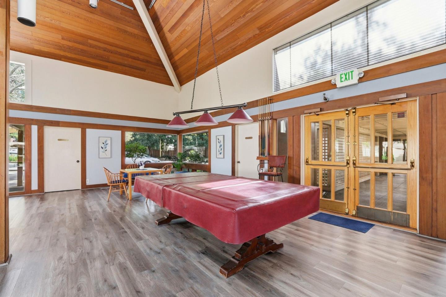 449 Alberto Way, Unit 132 Los Gatos, CA 95032 - Photo 42 of 42 a bedroom with a bed and wooden floor