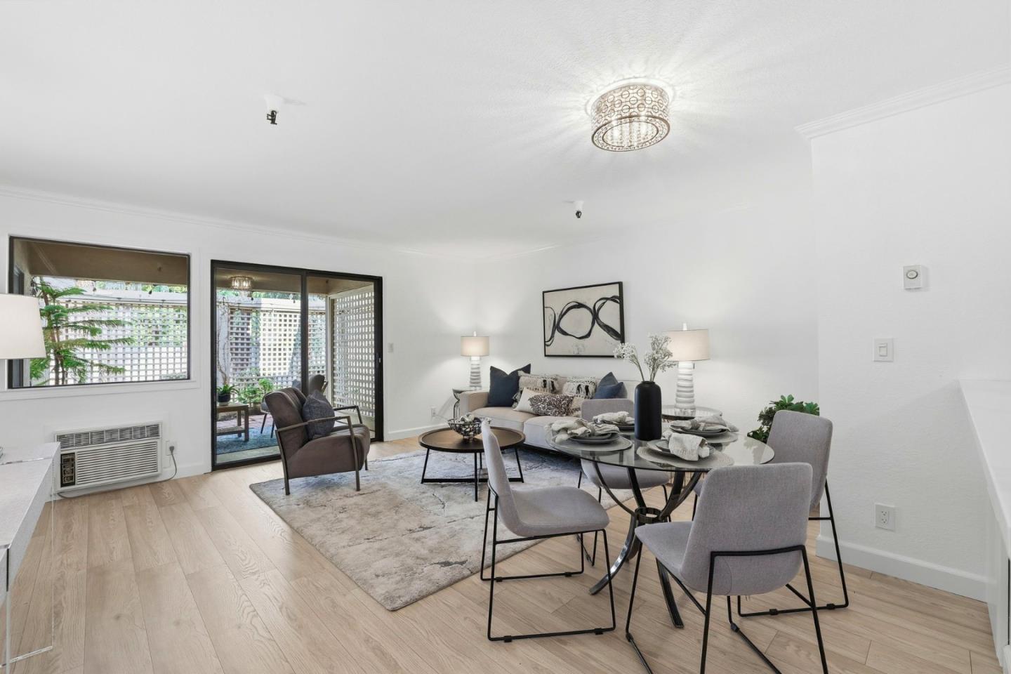 449 Alberto Way, Unit 132 Los Gatos, CA 95032 - Photo 5 of 42 a dining room with furniture and wooden floor