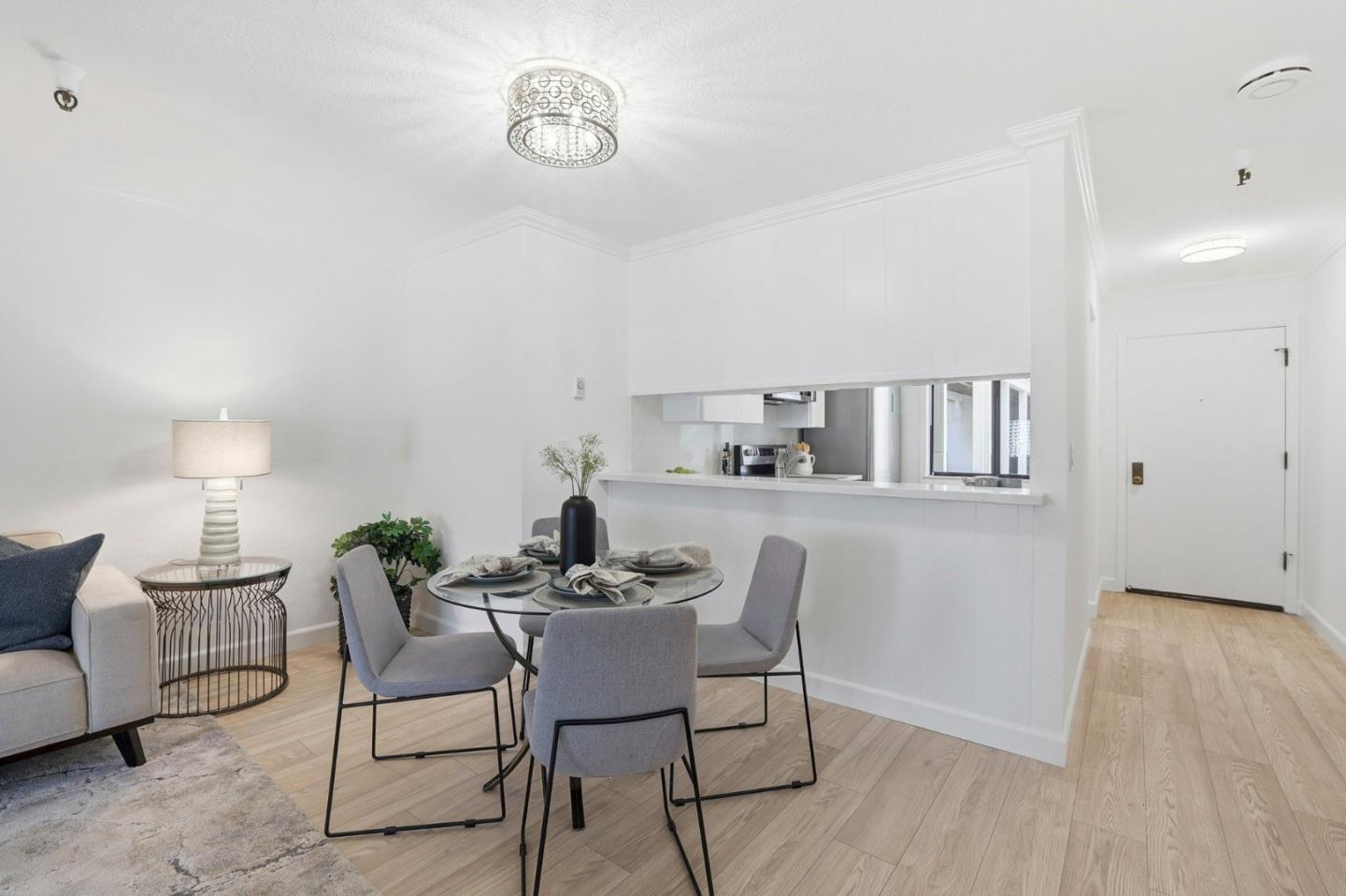449 Alberto Way, Unit 132 Los Gatos, CA 95032 - Photo 6 of 42 a dining room with furniture and wooden floor