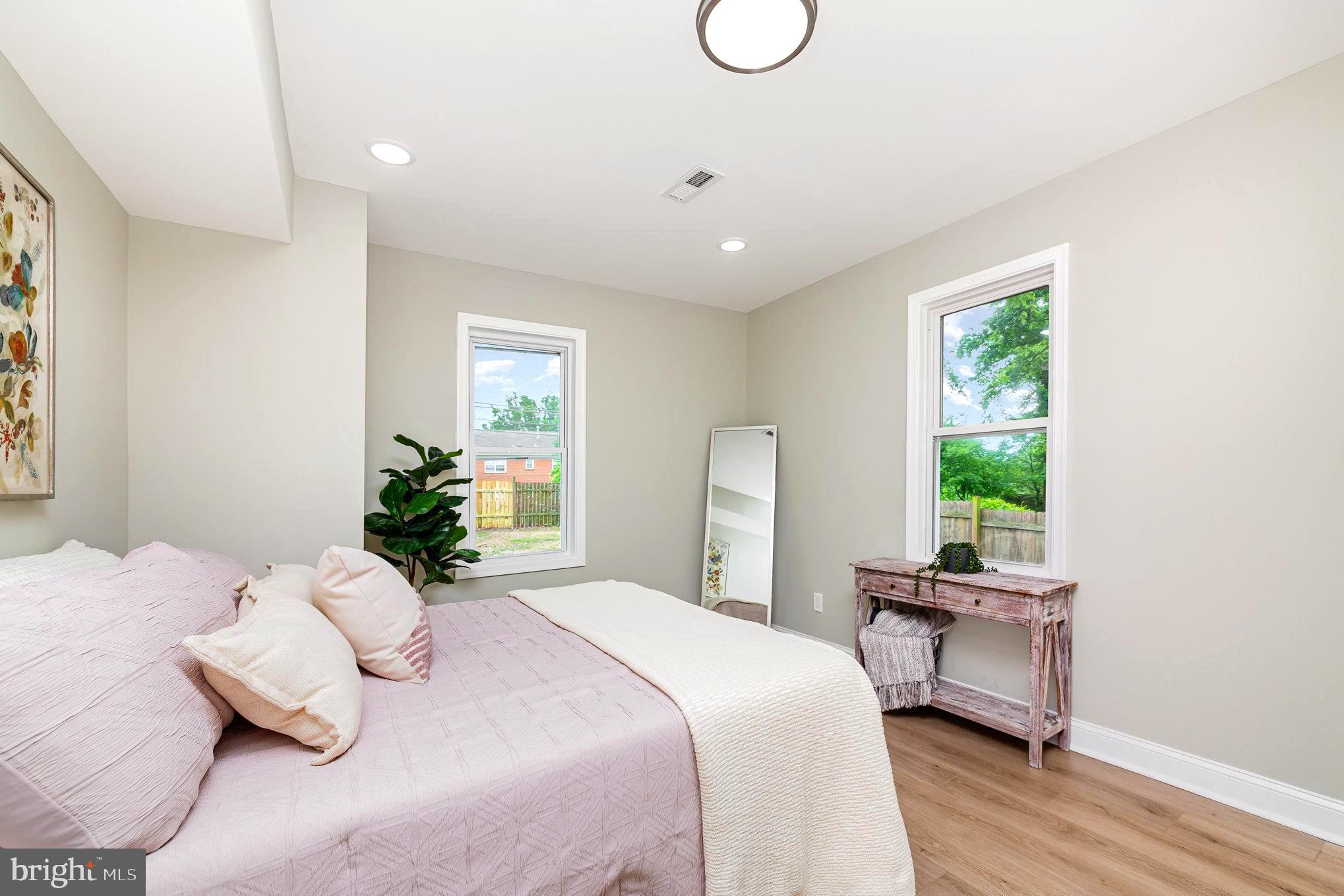 5611 Pilgrim Road Baltimore, MD 21214 - Photo 12 of 35 a bedroom with a bed and a window