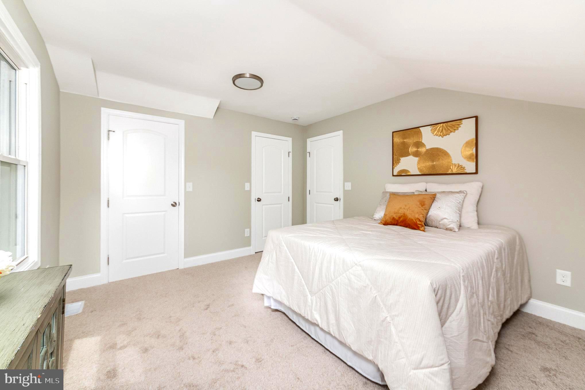 5611 Pilgrim Road Baltimore, MD 21214 - Photo 15 of 35 a bedroom with a bed and window