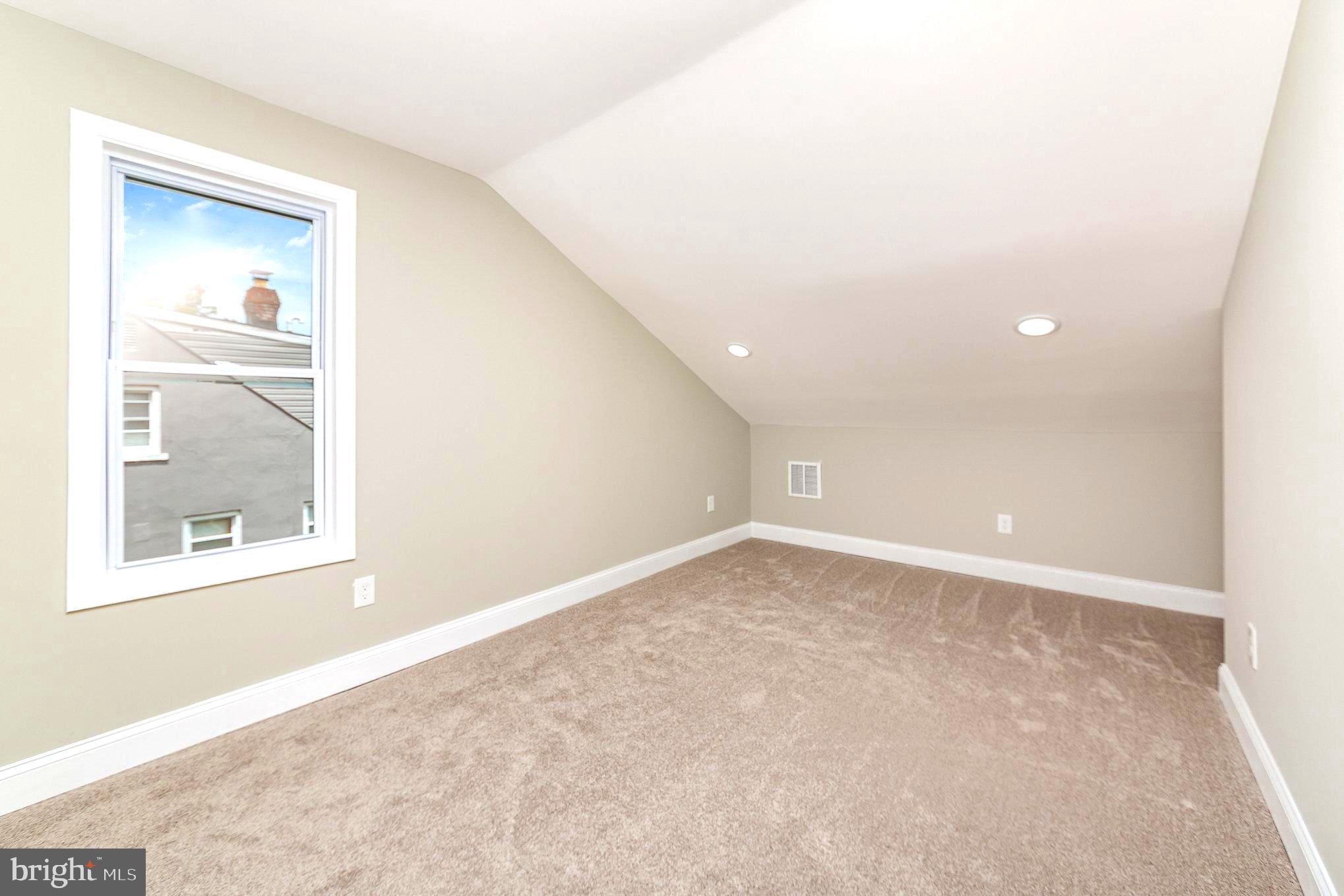 5611 Pilgrim Road Baltimore, MD 21214 - Photo 21 of 35 an empty room with a window