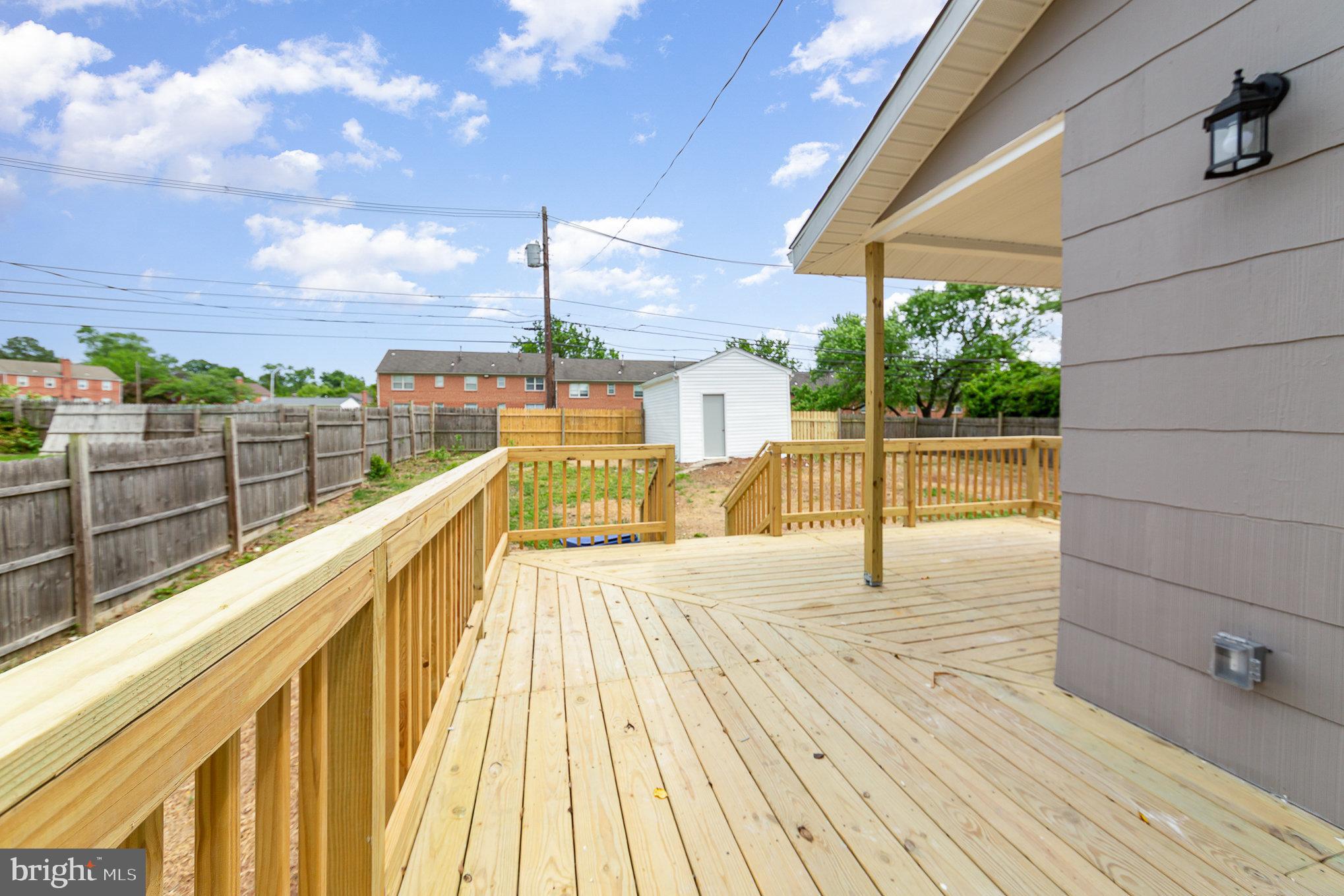 5611 Pilgrim Road Baltimore, MD 21214 - Photo 29 of 35 a view of a balcony with wooden floor and city view