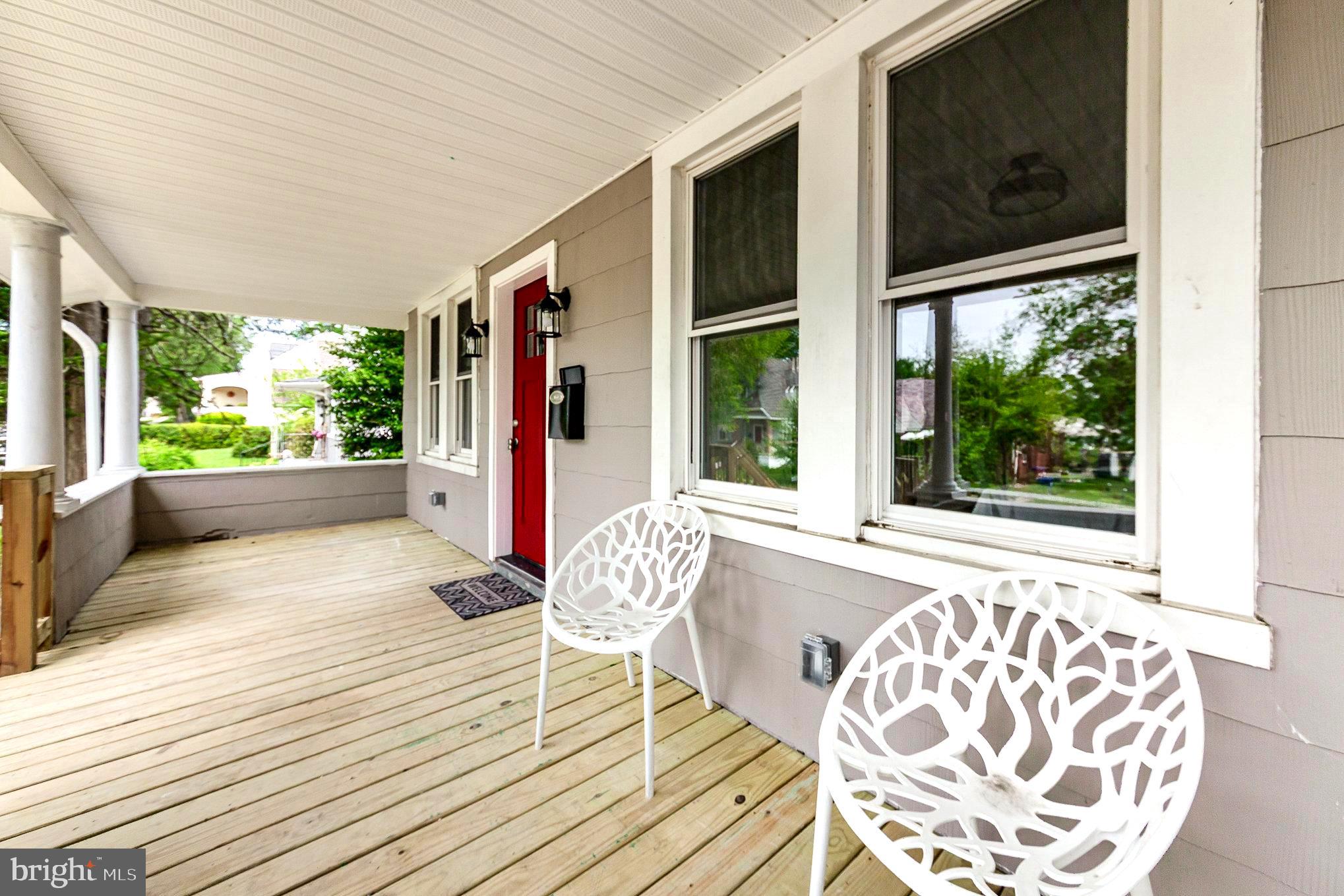 5611 Pilgrim Road Baltimore, MD 21214 - Photo 4 of 35 a porch with seating space and living room