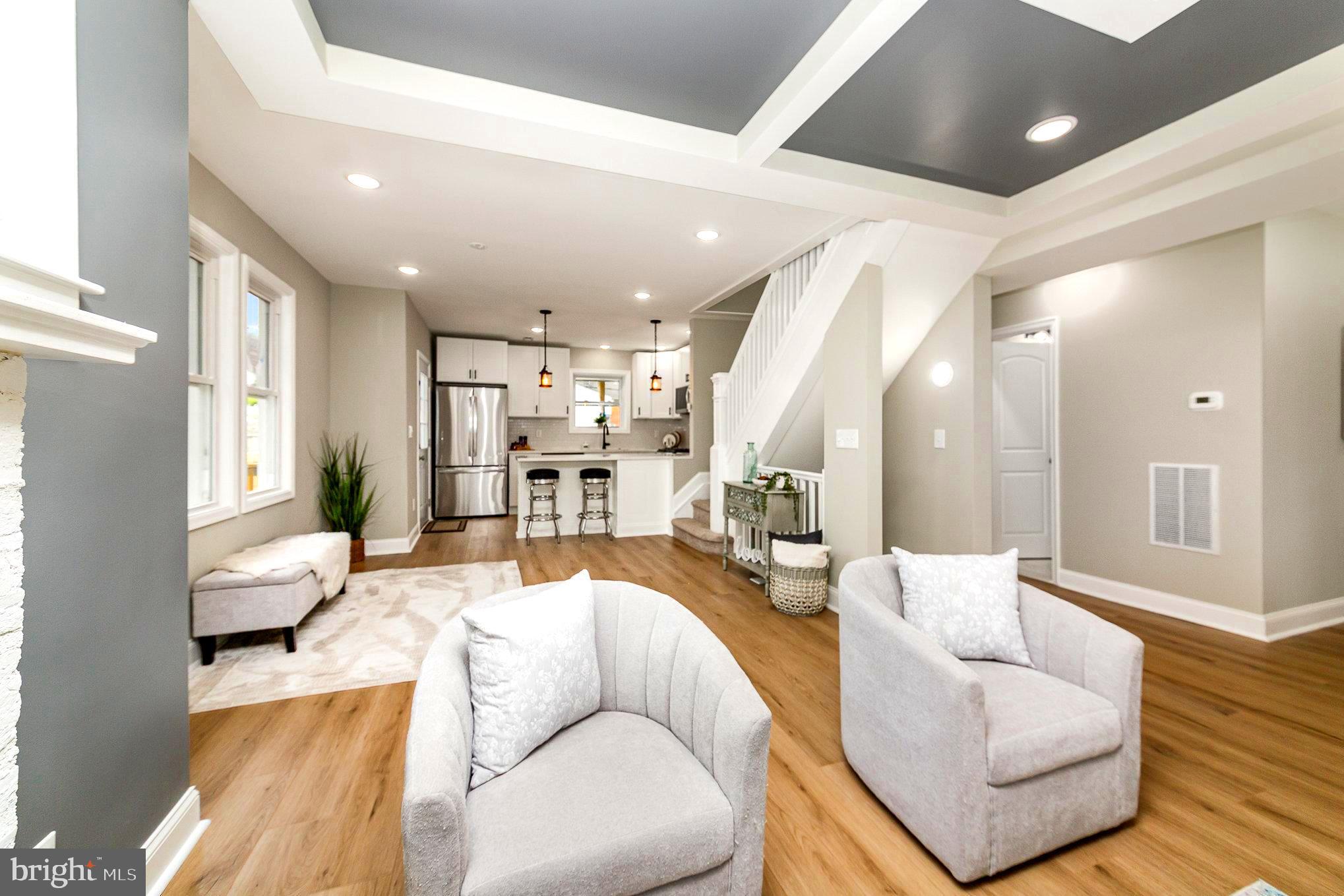 5611 Pilgrim Road Baltimore, MD 21214 - Photo 7 of 35 a living room with furniture and wooden floor