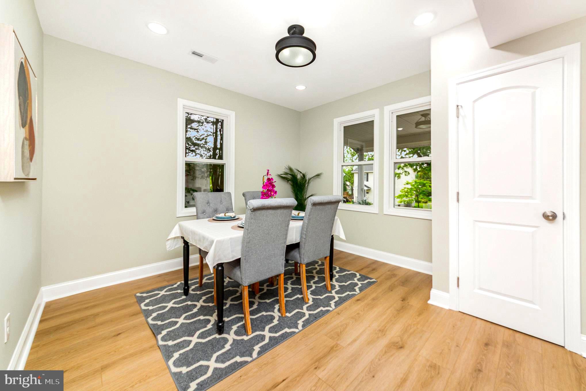 5611 Pilgrim Road Baltimore, MD 21214 - Photo 33 of 35 a view of a dining room with furniture and wooden floor