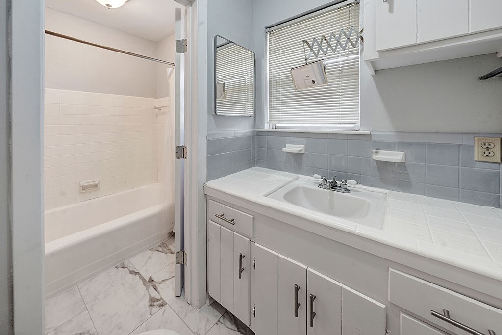 614 Gilpin Street Houston, TX 77034 - Photo 12 of 27 View of the ensuite bathroom as you enter from the primary bedroom!