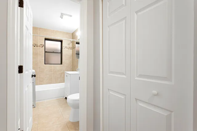 a bathroom with a toilet a sink and bath tub