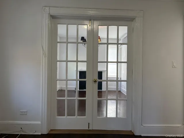 a view of wooden floor and windows in a room