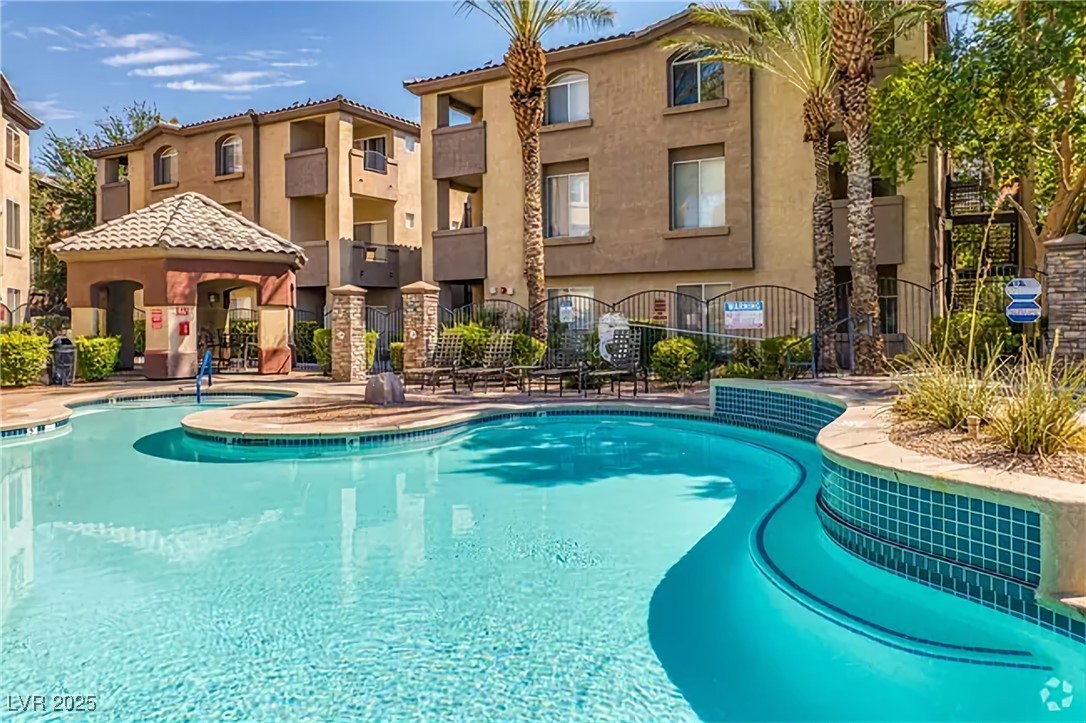 4400 South Jones Boulevard, Unit 2021 Las Vegas, NV 89103 - Photo 3 of 9 Community pool featuring a gazebo and a patio area