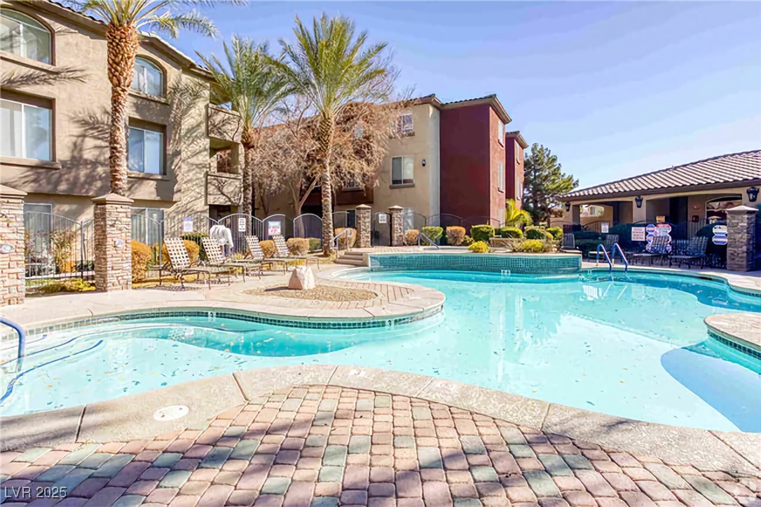4400 South Jones Boulevard, Unit 2021 Las Vegas, NV 89103 - Photo 8 of 9 Community pool with a patio area
