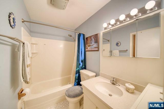 225 Doxey Drive Park Ridge, NJ 07656 - Photo 11 of 30 a bathroom with a sink toilet tub and shower