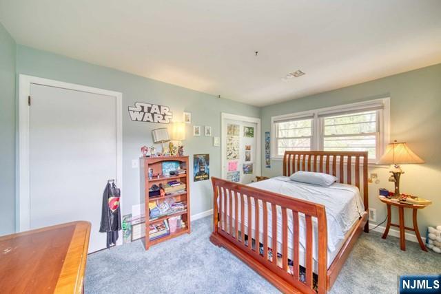 225 Doxey Drive Park Ridge, NJ 07656 - Photo 12 of 30 a bedroom with a bed and a window