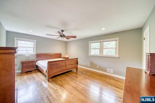 225 Doxey Drive Park Ridge, NJ 07656 - Photo 13 of 30 a bedroom with a bed and a window