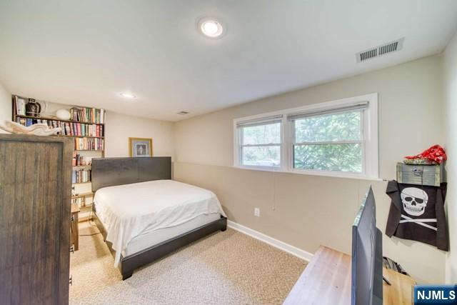 225 Doxey Drive Park Ridge, NJ 07656 - Photo 16 of 30 a bedroom with a bed and a window