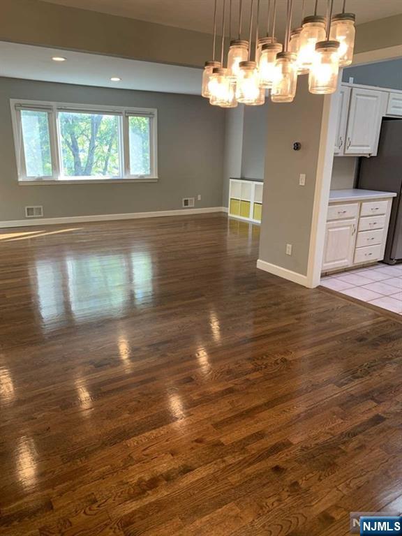 225 Doxey Drive Park Ridge, NJ 07656 - Photo 22 of 30 a view of a livingroom with furniture wooden floor and chandelier