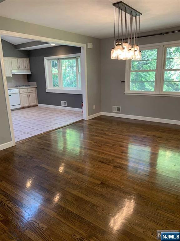 225 Doxey Drive Park Ridge, NJ 07656 - Photo 24 of 30 an empty room with wooden floor fan and window