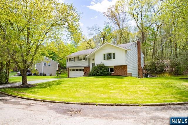 225 Doxey Drive Park Ridge, NJ 07656 - Photo 30 of 30 a view of an house with a swimming pool and porch