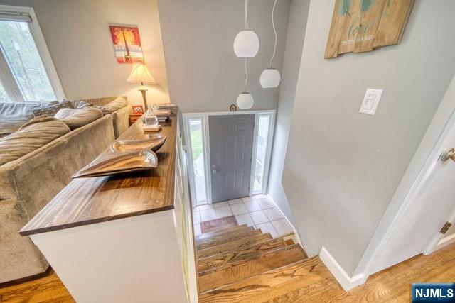 225 Doxey Drive Park Ridge, NJ 07656 - Photo 7 of 30 a kitchen with a sink and a refrigerator