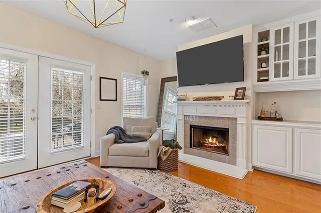 a living room with furniture fireplace and flat screen tv