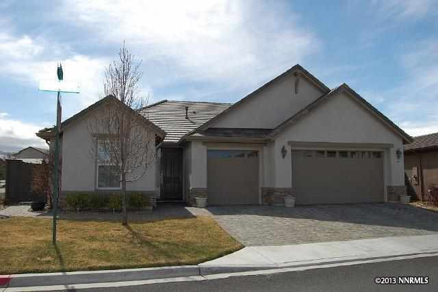 a front view of a house with garage