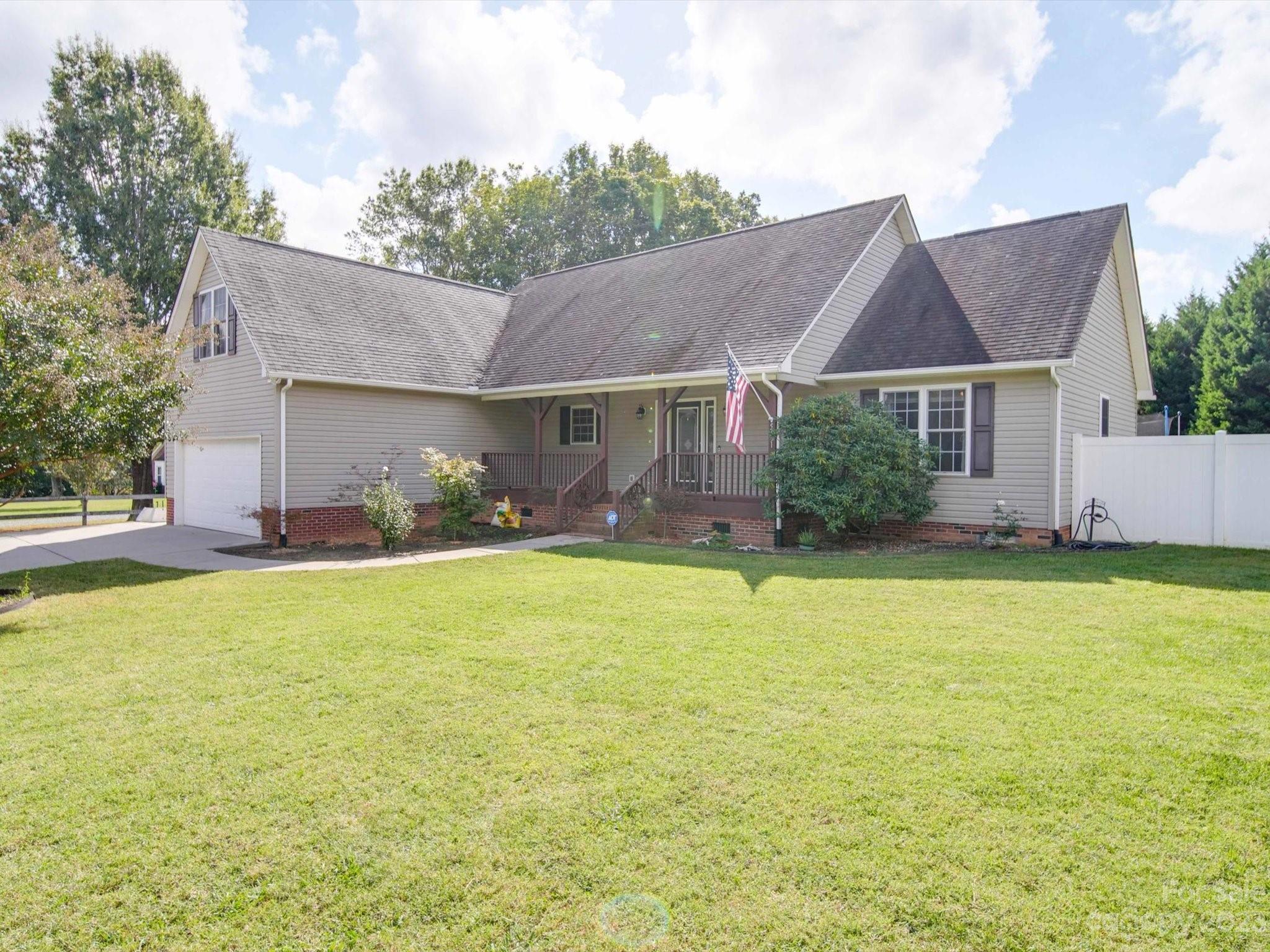 5351 Faith Road Salisbury, NC 28146 - Photo 1 of 32 a front view of house with an outdoor space and seating