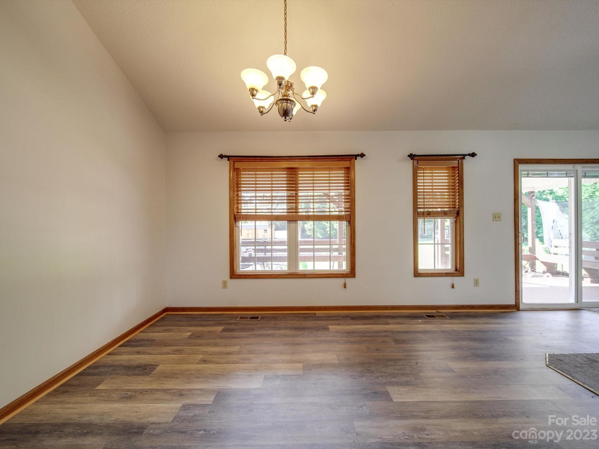 5351 Faith Road Salisbury, NC 28146 - Photo 13 of 32 a view of an empty room with wooden floor and a window