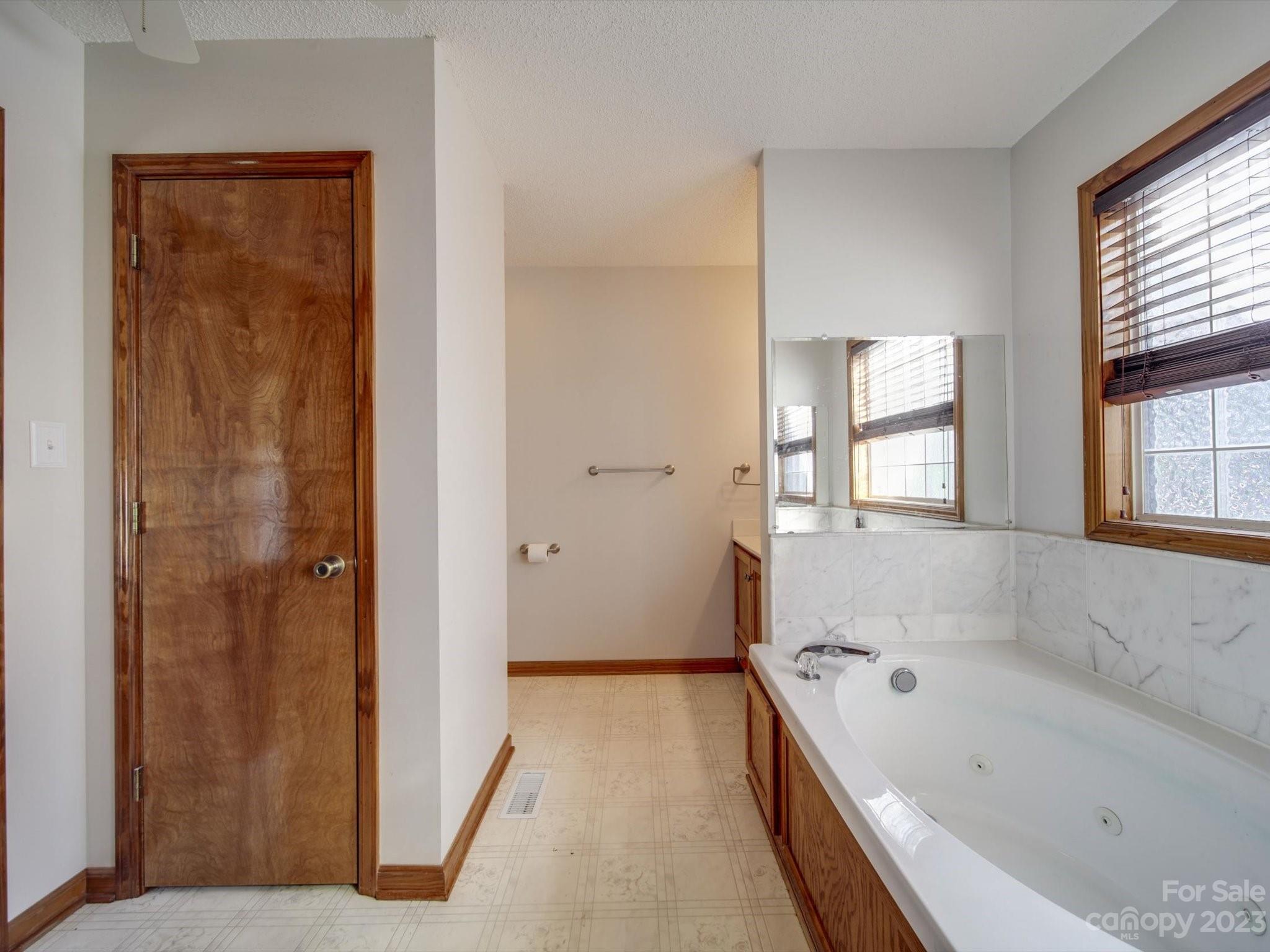 5351 Faith Road Salisbury, NC 28146 - Photo 20 of 32 a bathroom with a bathtub and a shower