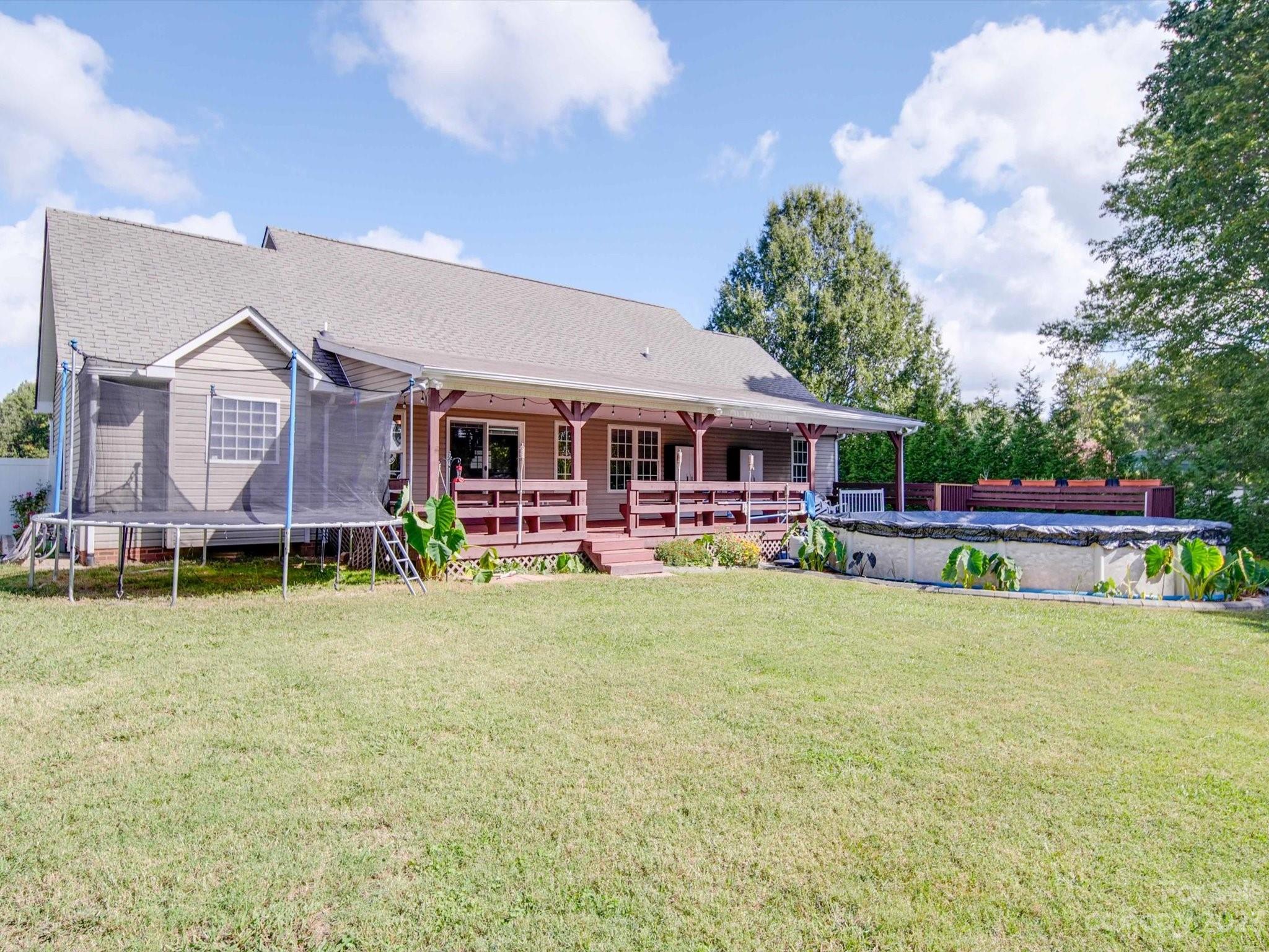 5351 Faith Road Salisbury, NC 28146 - Photo 23 of 32 a view of house with outdoor space and swimming pool
