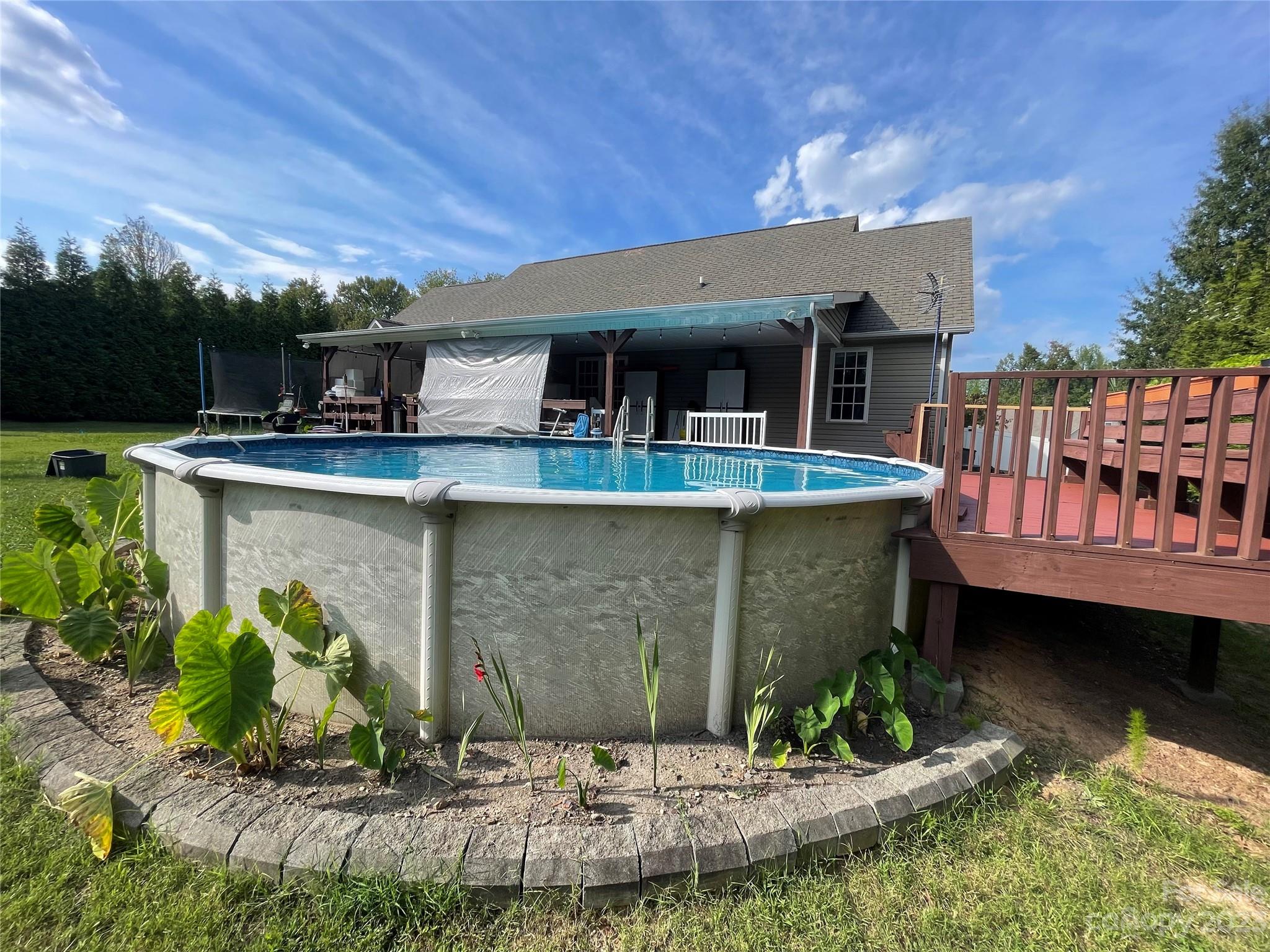 5351 Faith Road Salisbury, NC 28146 - Photo 24 of 32 a view of a swimming pool with a patio