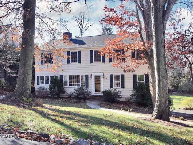 26 Webb Road Westport, CT 06880 - Photo 1 of 1 a front view of house with yard and trees around
