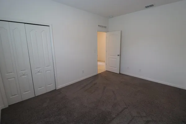 an empty room with a empty space and a window