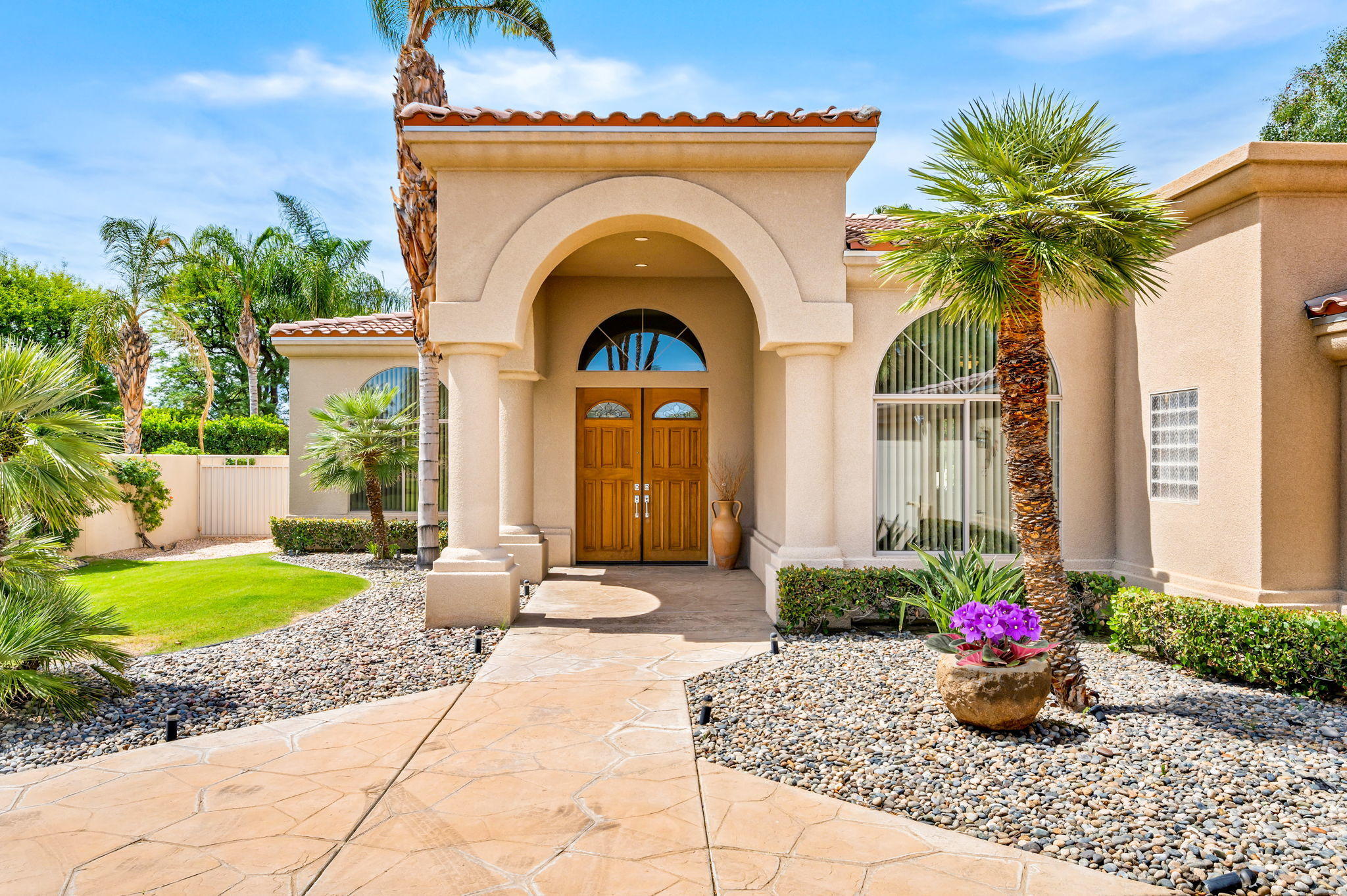 70615 Sunny Lane Rancho Mirage, CA 92270 - Photo 1 of 41 a front view of a house with fountain
