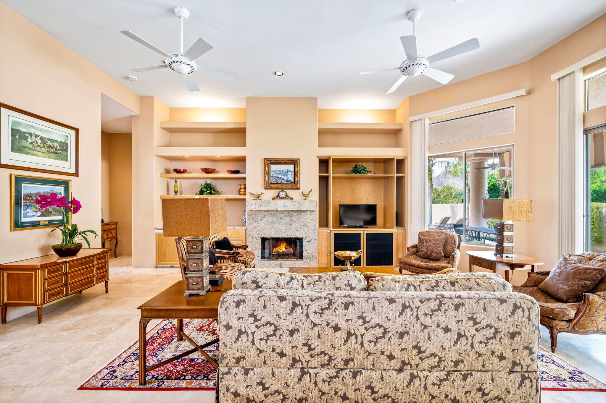 70615 Sunny Lane Rancho Mirage, CA 92270 - Photo 14 of 41 a living room with furniture fireplace and flat screen tv