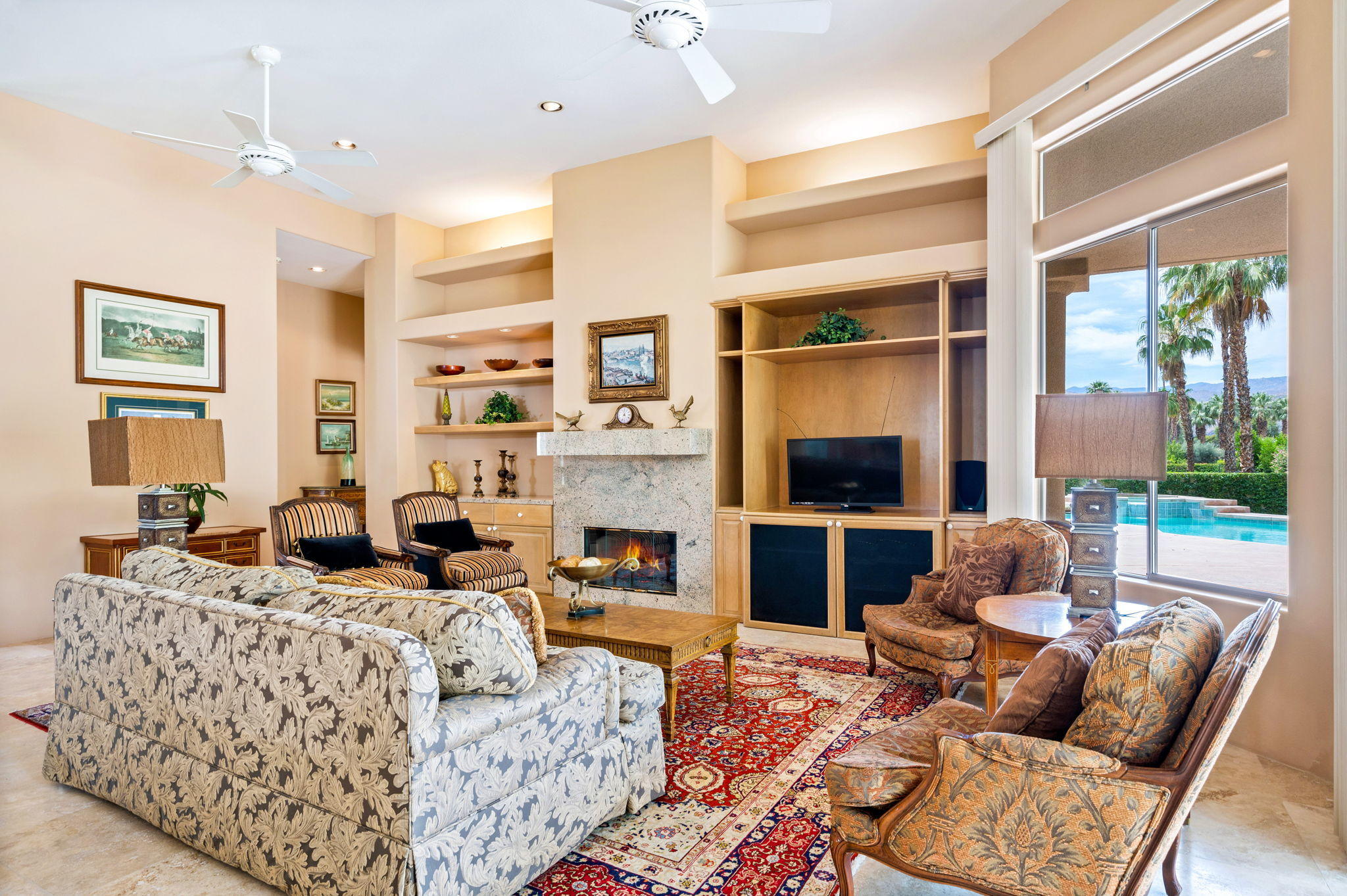70615 Sunny Lane Rancho Mirage, CA 92270 - Photo 15 of 41 a living room with furniture fireplace and a large window