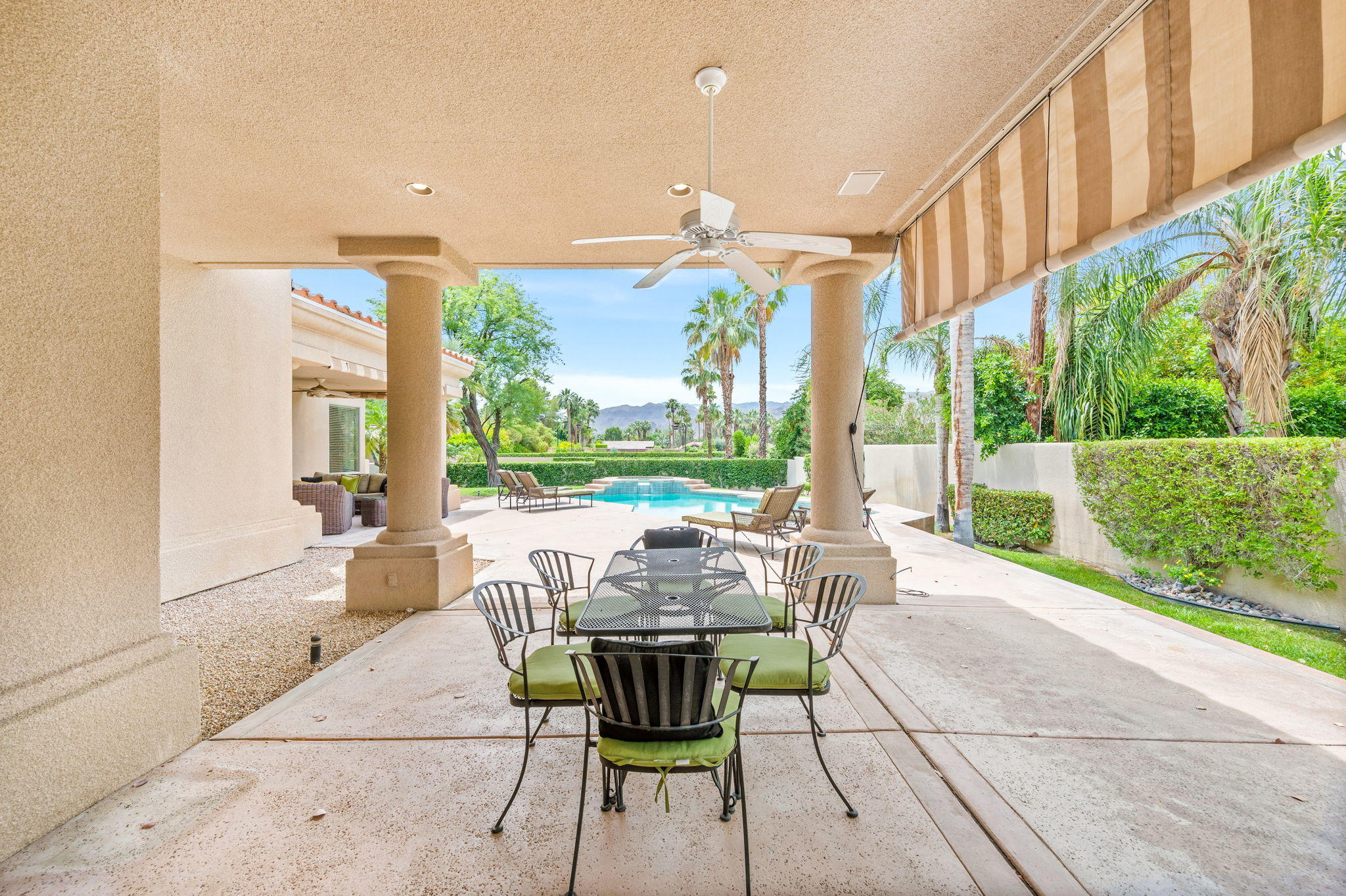 70615 Sunny Lane Rancho Mirage, CA 92270 - Photo 18 of 41 a view of an outdoor dining space with a table and chairs