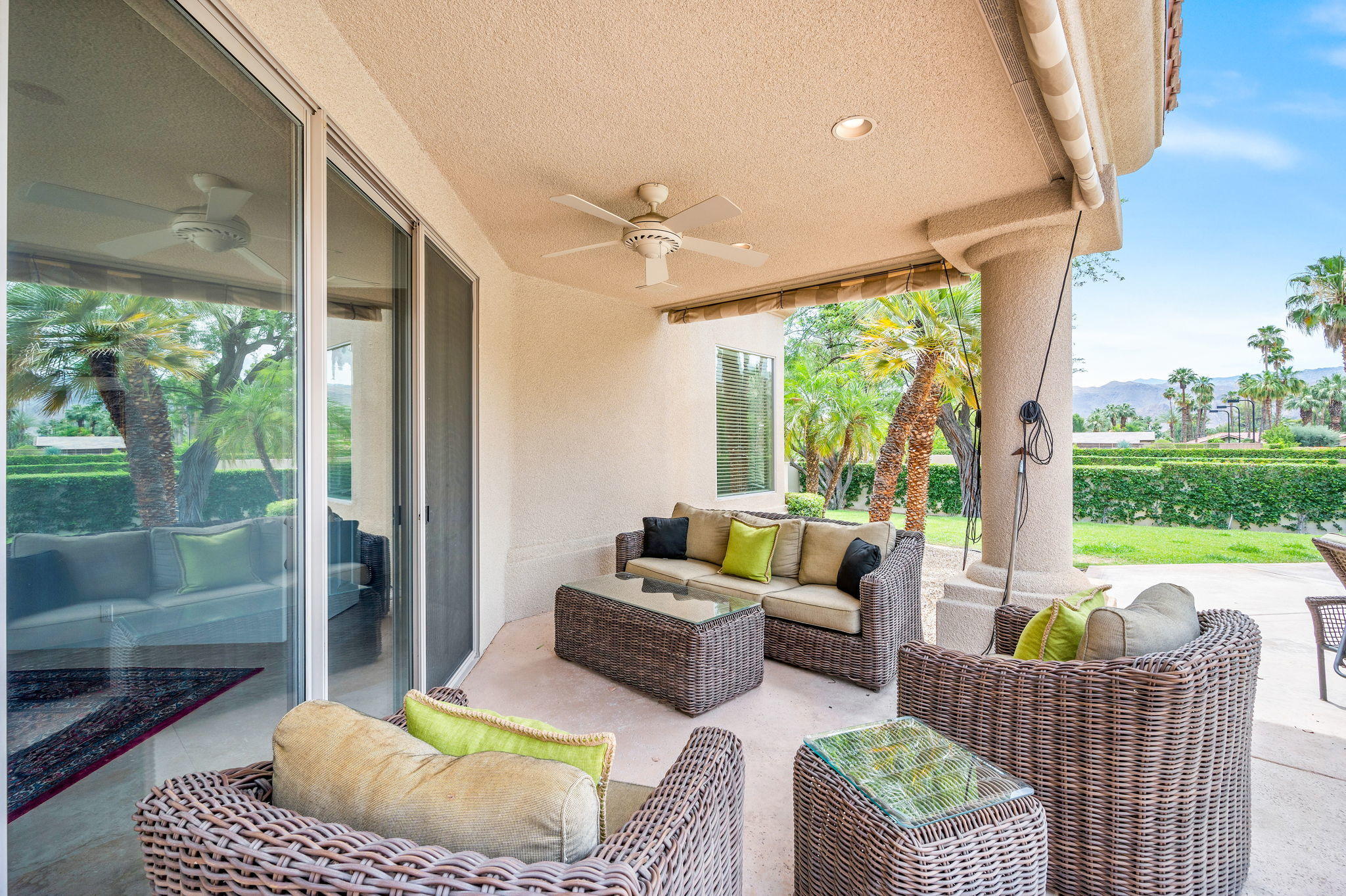 70615 Sunny Lane Rancho Mirage, CA 92270 - Photo 19 of 41 a living room with furniture and a floor to ceiling window