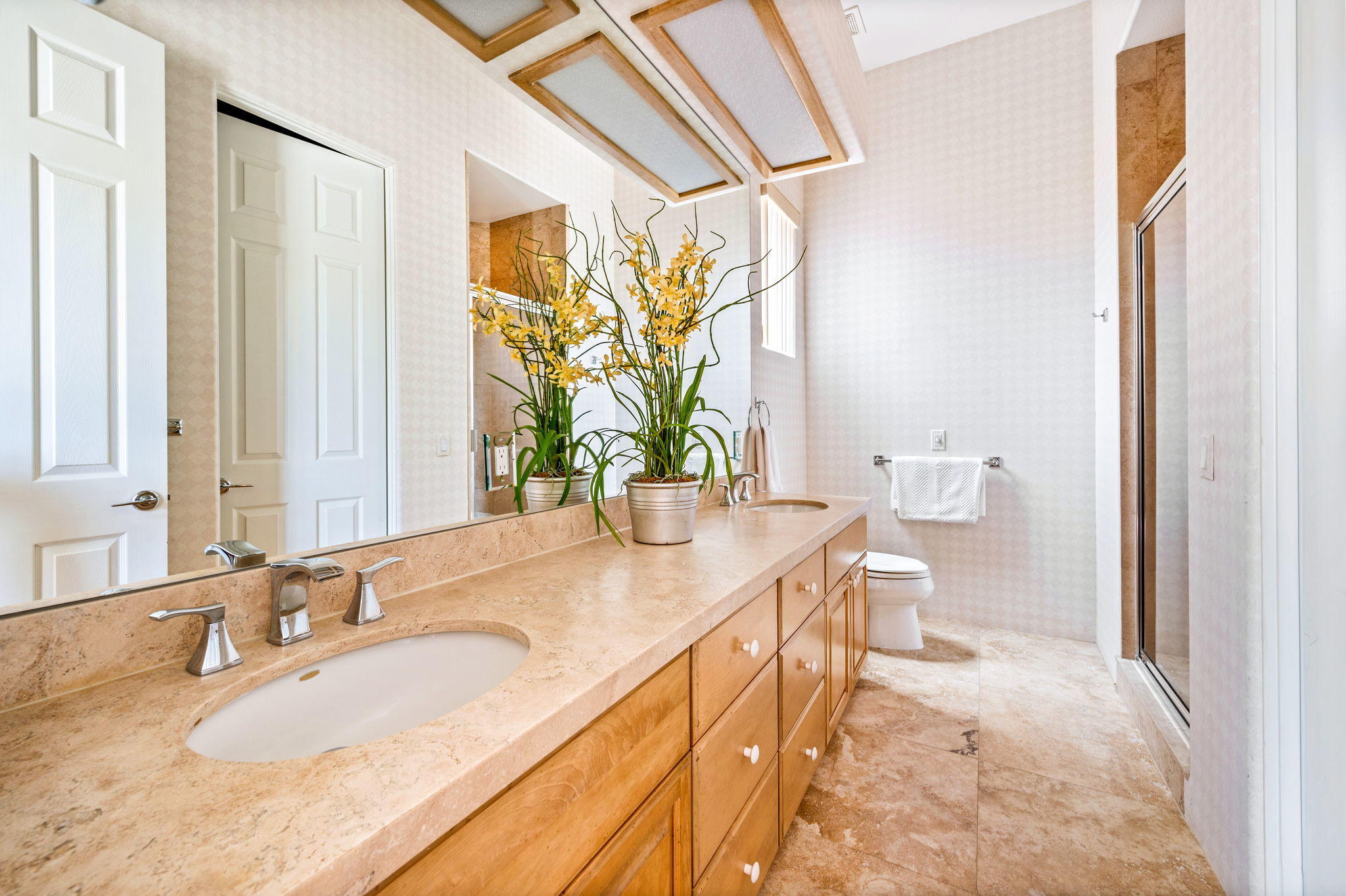 70615 Sunny Lane Rancho Mirage, CA 92270 - Photo 30 of 41 a bathroom with a granite countertop sink a toilet and a mirror