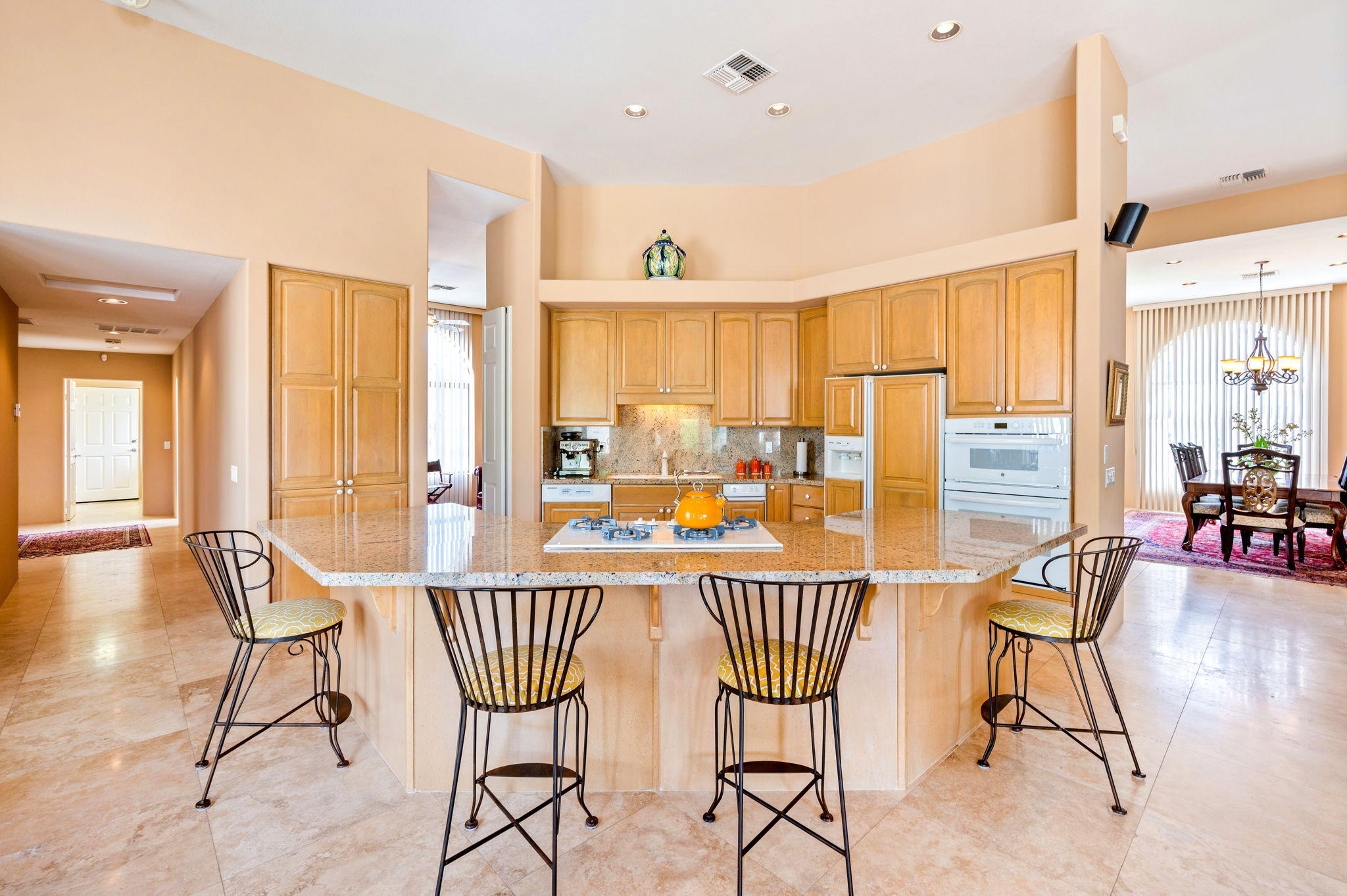 70615 Sunny Lane Rancho Mirage, CA 92270 - Photo 9 of 41 a view of a dining room with furniture a chandelier and wooden floor
