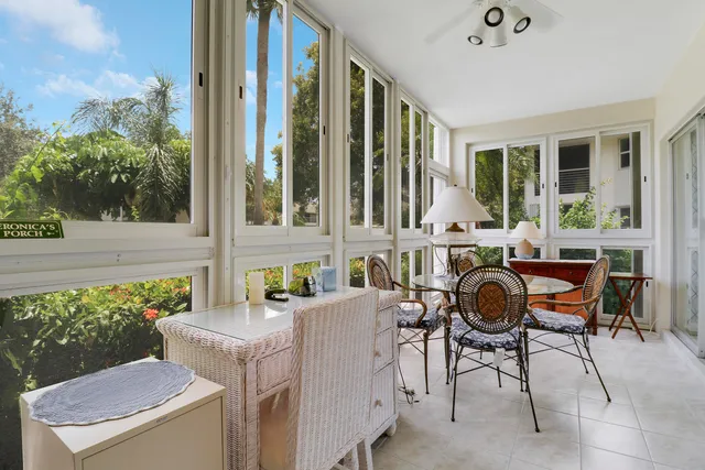 a living room with furniture a window and a fireplace