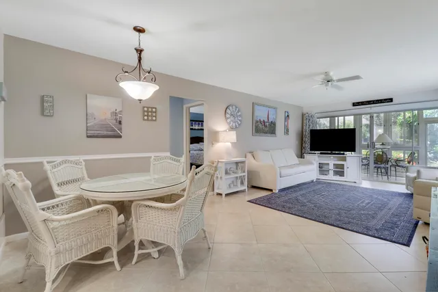 a view of a livingroom with furniture and a flat screen tv