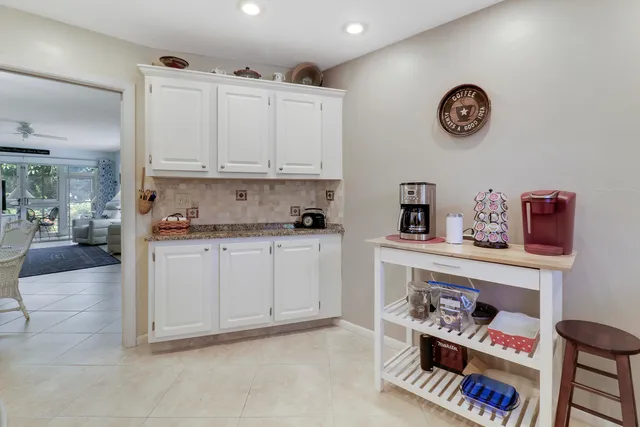 a view of kitchen with cabinets and outdoor view