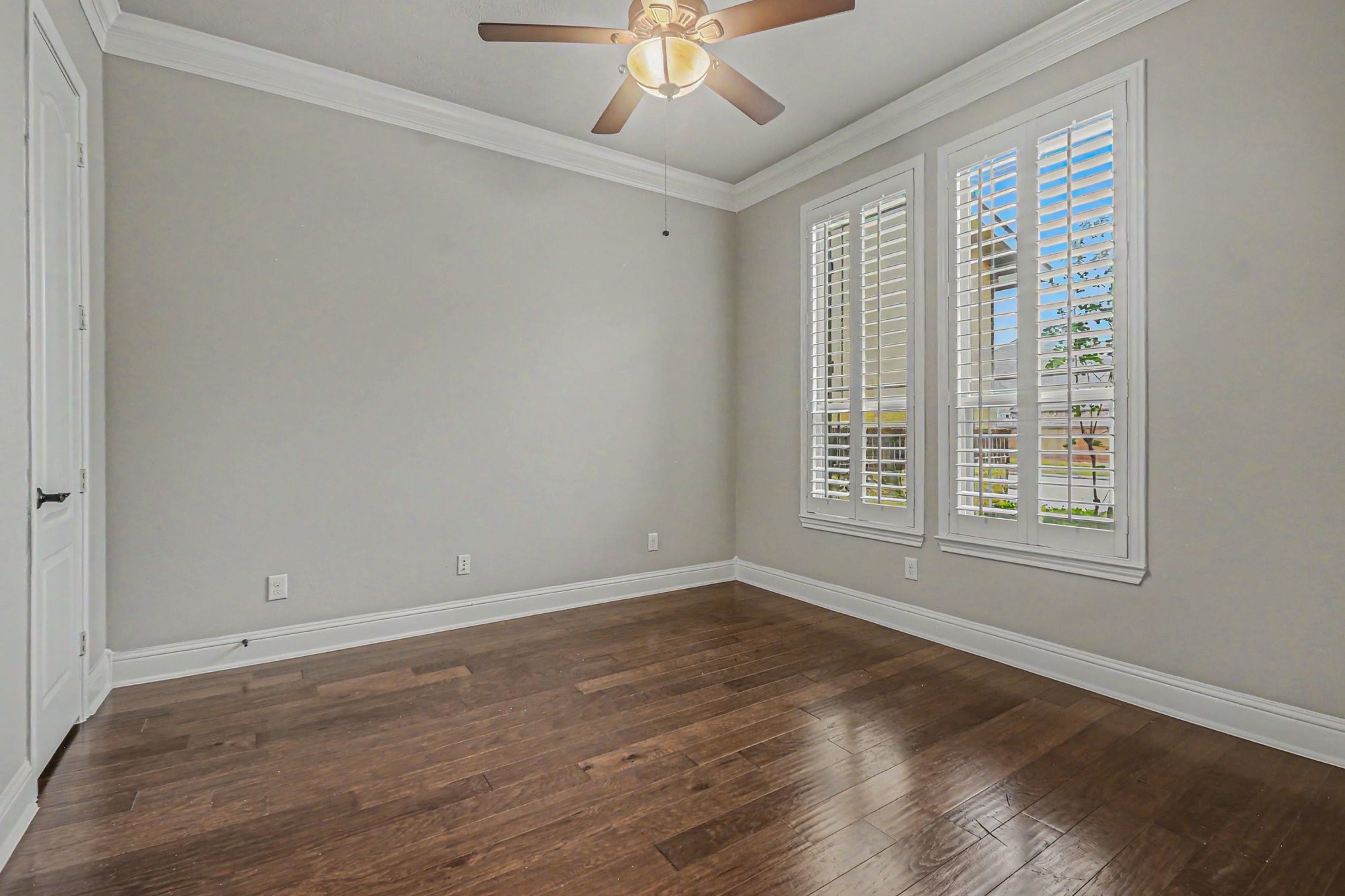 3310 Ralston Edge Lane Houston, TX 77059 - Photo 9 of 50 a view of an empty room with wooden floor and a window