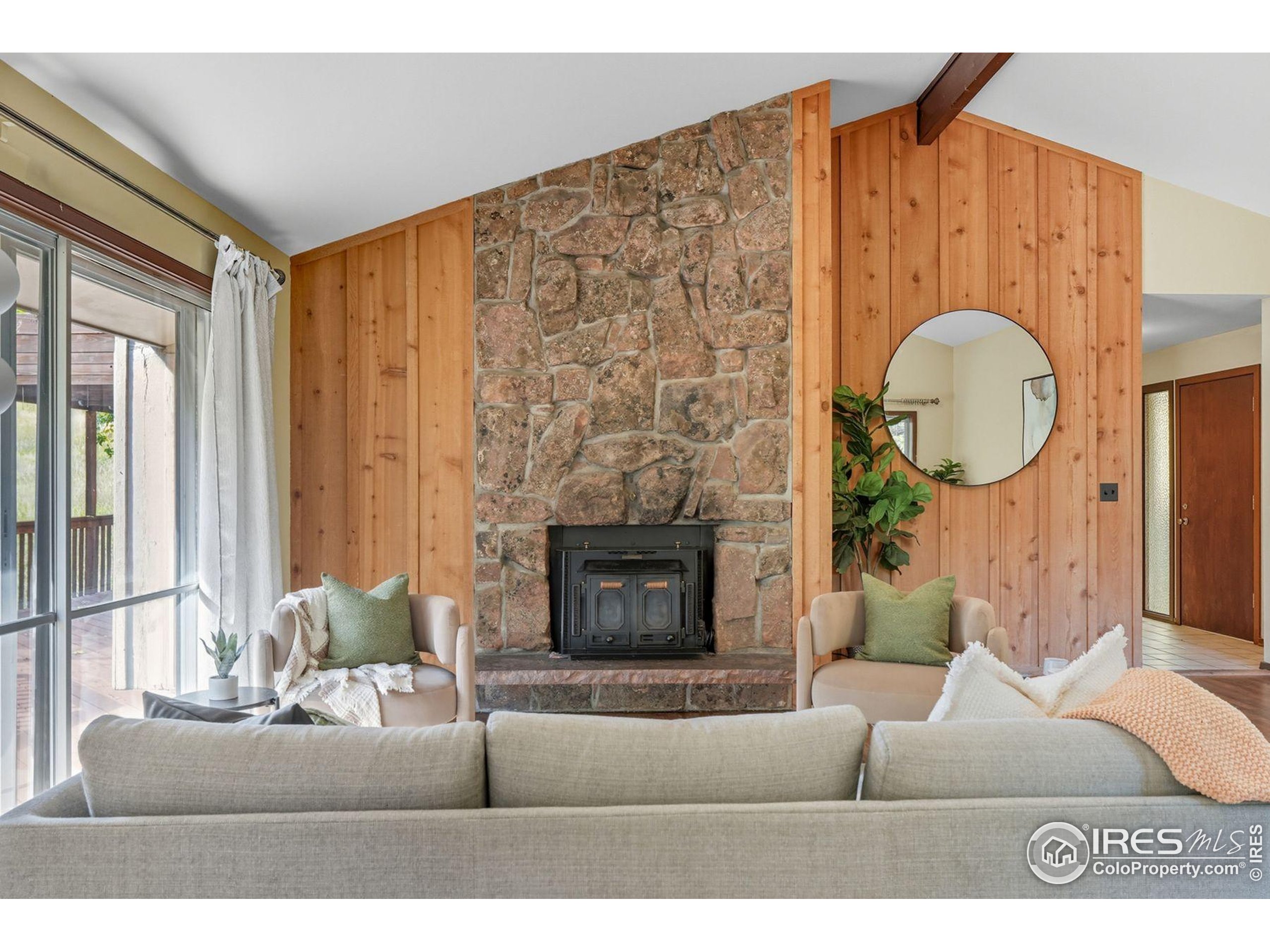 1037 Wagonwheel Gap Road Boulder, CO 80304 - Photo 16 of 43 a living room with furniture and a fireplace