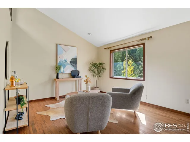 a dining room with furniture and a window