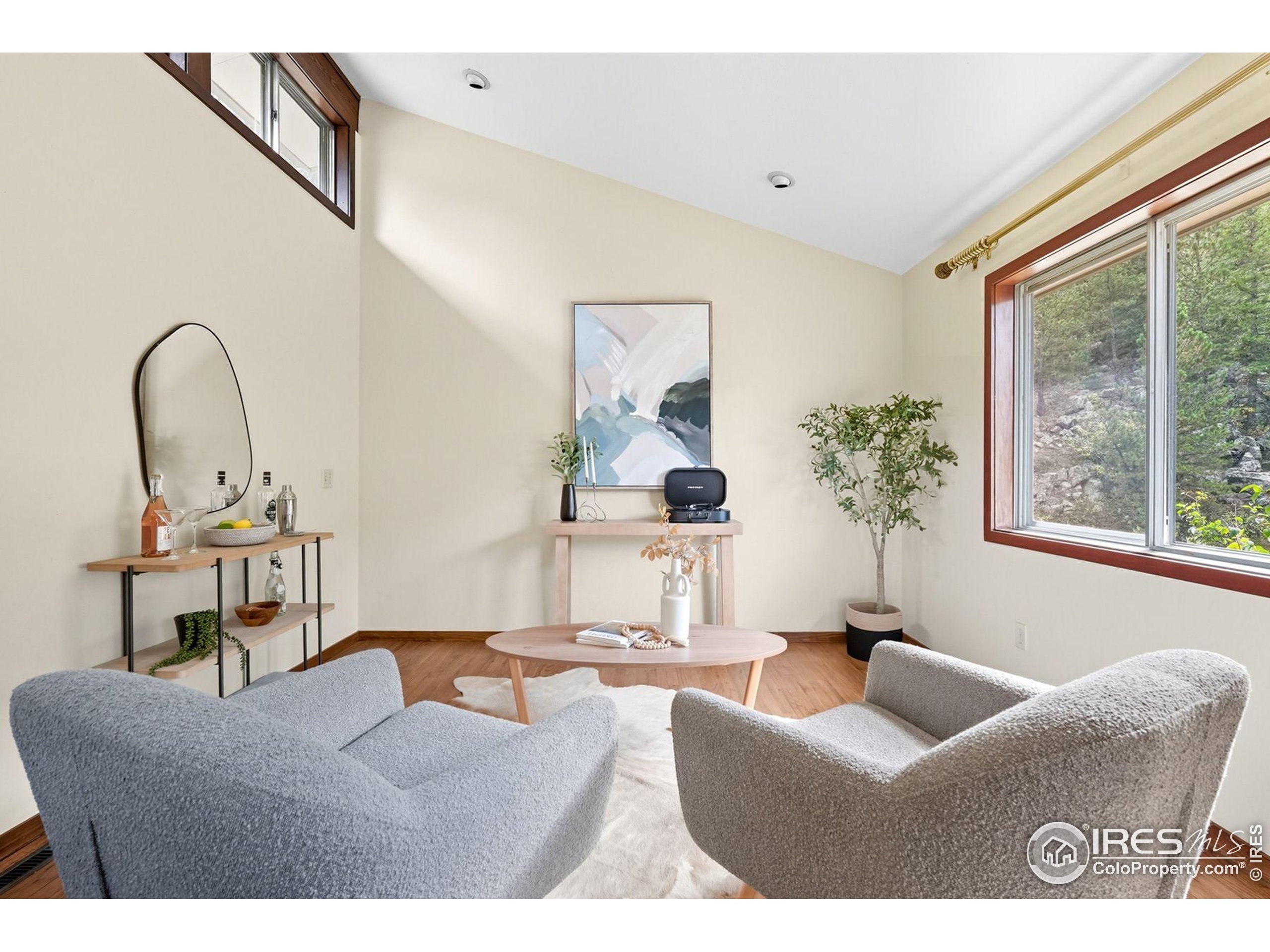 1037 Wagonwheel Gap Road Boulder, CO 80304 - Photo 19 of 43 a living room with furniture and a large window
