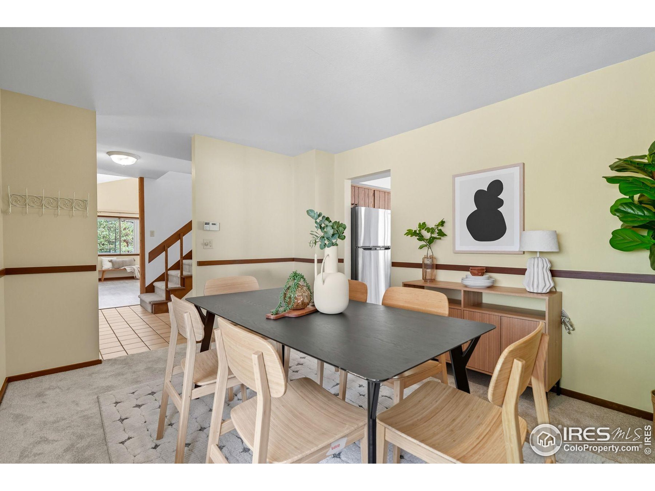 1037 Wagonwheel Gap Road Boulder, CO 80304 - Photo 20 of 43 a view of a dining room with furniture and a potted plant